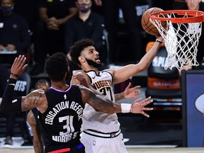 Jamal Murray of the Denver Nuggets drives to the basket against Marcus Morris of the L.A. Clippers this week.