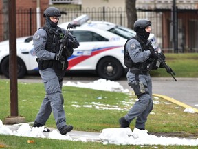 Toronto police attend the scene of a shooting death inside an apartment building at 4175 Lawrence Ave. in Toronto, Ont. on Sunday, Nov. 18 2018. The death represents the 90th murder of the year — Toronto's deadliest in record. Bryan Passifiume/Toronto Sun/Postmedia Network