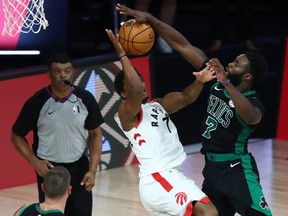 Boston Celtics guard Jaylen Brown (right) fouls Toronto Raptors guard Kyle Lowry (left) during the second half of game two.
