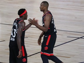 Raptors big men Serge Ibaka (right) and Pascal Siakam celebrate during their Game 4 win.