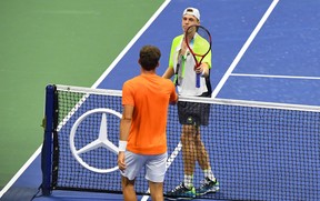 Pablo Carreno Busta of Spain greets Denis Shapovalov of Canada at the net after winning the fifth set and match against in the men’s singles quarter-finals match on day nine of the 2020 U.S. Open tennis tournament at USTA Billie Jean King National Tennis Center.
