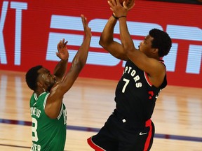 Raptors' Kyle Lowry gets off his crucial, turnaround, fadeaway jumped against the Celtics' Kemba Walker in double overtime in Game 6 Sept. 9, 2020.