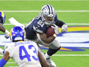 Dallas Cowboys running back Ezekiel Elliott (21) runs the ball for a gain against the Los Angeles Rams in Week 1. The Cowboys take on the Falcons on Sunday.