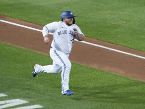 Toronto Blue Jays catcher Alejandro Kirk scores a run during the third inning against the New York Yankees on Monday night.