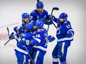 Tampa Bay Lightning centre Brayden Point (21) and left wing Ondrej Palat (18) and center Alex Killorn (17) and right wing Nikita Kucherov (86) and defenceman Victor Hedman (77) celebrate a goal against the Dallas Stars during the first period in Game 2.