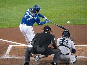 Blue Jays' Vladimir Guerrero Jr. hits an RBI single  during the first inning against the New York Yankees at Sahlen Field.