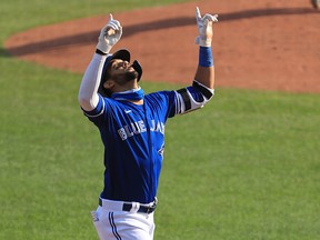 Lourdes Gurriel Jr. of the Toronto Blue Jays points to the sky celebrating his home run in the third inning at Sahlen Field on September 27, 2020 in Buffalo.