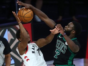 Celtics guard Jaylen Brown (right) fouls Raptors guard Kyle Lowry (left) during the second half of Game 2 of the second round of the 2020 NBA Playoffs at ESPN Wide World of Sports Complex, in Lake Buena Vista, Fla., Tuesday, Sept. 1, 2020.
