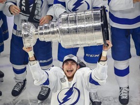 Lightning centre Anthony Cirelli hoists the Stanley Cup after Tampa Bay defeated the Dallas Stars in Game 6 on Monday night.