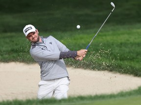 Canadian Corey Conners plays from a greenside bunker during a practice round for the U.S. Open on Tuesday. Conners has a 7-wood in his bag this week to help deal with the brutal rough at Winged Foot.