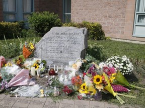 A memorial grows at Monsignor Paul Dwyer Catholic High School in Oshawa on Sunday, September 6, 2020. Mass murder victim Chris Traynor was a teacher at the school. Toronto Sun