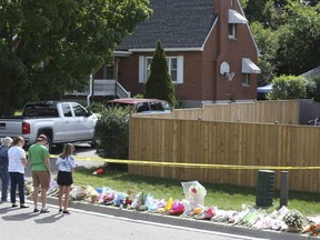 A steady stream of mourners arrive on Sunday Sept. 6, 2020 at the Oshawa home where a father and three of hsi children were slain.