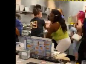 Two female and one male customer brawl with staff at an unidentified Waffle House.