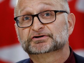 Attorney General David Lametti takes part in a press conference at the National Press Theatre in Ottawa, Feb. 24, 2020.