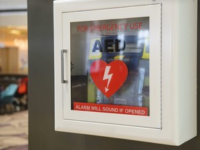 Automated External Defibrillator (AED) on a wall.