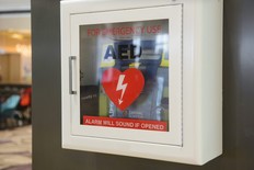 Automated External Defibrillator (AED) on a wall.