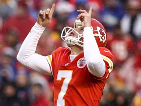 Harrison Butker of the Kansas City Chiefs points to the sky after a successful point after attempt.