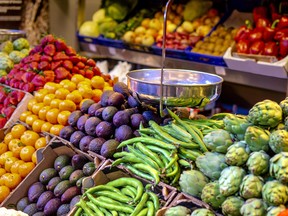 colorful fruits and vegetables in blocks with an scale on farmers market to sell fuits