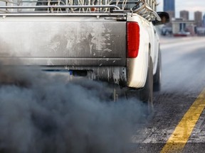 Black smoke issuing forth from the exhaust of a diesel pickup truck