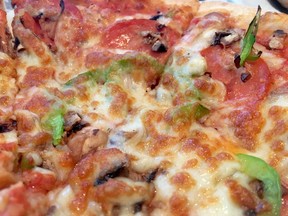 An up-close look at a delicious pizza from Il Paesano.