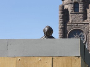 The statue of Sir John A. MacDonald at Queen's Park is still wrapped up and boxed in. CRAIG ROBERTSON/TORONTO SUN