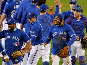 The Blue Jays celebrate a win against the New York Yankees at Sahlen Field that clinched a postseason berth on Sept. 24, 2020 in Buffalo.