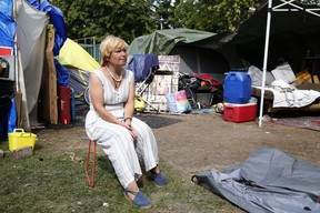 Julie Watson, 55, who has been camping out in Alexandra Park, one of the many tent cities that have sprung up across Toronto during the pandemic, is seen here on Thursday, Sept. 24, 2020.