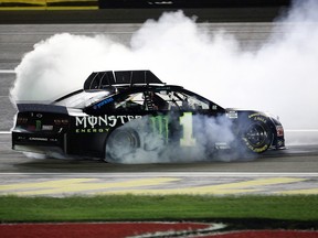 Kurt Busch, driver of the #1 Monster Energy Chevrolet, celebrates with a burnout after winning the NASCAR Cup Series South Point 400 at Las Vegas Motor Speedway on September 27, 2020 in Las Vegas, Nevada.