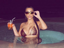 Kim Kardashian posted a recent photo of herself taking a dip in snakeskin bikini.
