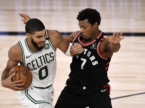 Boston Celtics’ Jayson Tatum drives the ball during the fourth quarter as Raptors’ Kyle Lowry guards during Game 4 of their second-round playoff series on Saturday night in Lake Buena Vista, Fla. Game 5 goes Monday night.
