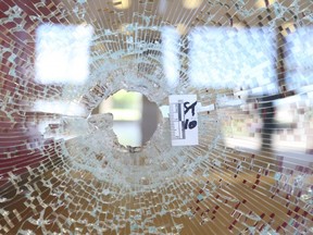 A bullet hole in a lobby window at 7230 Darcel Ave. in Malton after a drive-by shooting on Wednesday, Sept. 2, 2020.