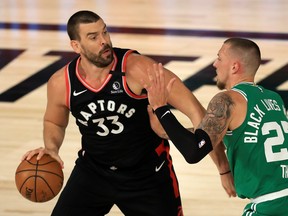 Raptors' Marc Gasol drives the ball against Daniel Theis of the Boston Celtics during Game 6 of their Eastern semifinal in Lake Buena Vista, Fla.