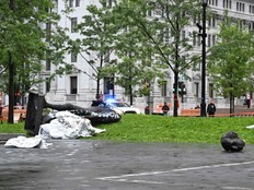 A statue of the first Canadian Prime Minister Sir John A. Macdonald lies on the ground, with the statue's head a few metres away, at Canada Park in central Montreal on Aug. 29, 2020, after it was pulled down by anti-racism protesters during a demonstration calling for the defunding of the police.