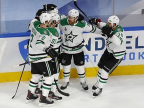 Dallas Stars centre Joe Pavelski (16) celebrates with teammates after scoring against the Tampa Bay Lightning at Rogers Place.