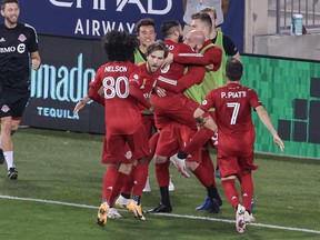 Toronto FC players celebrate midfielder Alejandro Pozuelo's goal  in the second half against New York City FC at Red Bull Arena on Wednesday night.