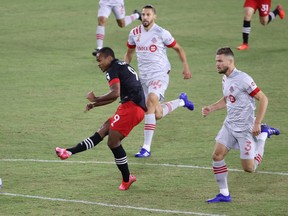 D.C. United forward Ola Kamara (left) scores against Toronto FC during the first half at Audi Field on Saturday night.