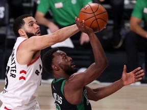 Fred VanVleet of the Toronto Raptors blocks a shot by Kemba Walker of the Boston Celtics during Game 7 at AdventHealth Arena at the ESPN Wide World Of Sports Complex on September 11, 2020 in Lake Buena Vista, Florida.