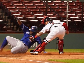 Blue Jays’ Vladimir Guerrero Jr. is tagged out at home by Red Sox catcher Christian Vazquez during the fourth inning on Thursday night at Fenway Park in Boston. The Jays have performed poorly on the basepaths this season.