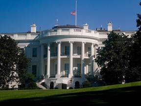 The American flag above the White House is seen at half staff after the death of Supreme Court Justice Ruth Bader Ginsburg, in Washington, D.C., Sunday, Sept. 20, 2020.