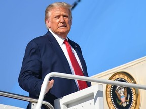 US President Donald Trump makes his way to board Air Force One before departing from Andrews Air Force Base in Maryland on September 21, 2020.