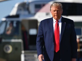 US President Donald Trump makes his way to board Air Force One before departing from Andrews Air Force Base in Maryland on September 21, 2020.