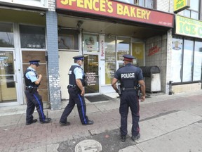 Toronto Police outside Spence's Bakery restaurant on Eglinton Ave. W. after a drive-by shooting wounded six people on Wednesday September 2, 2020.