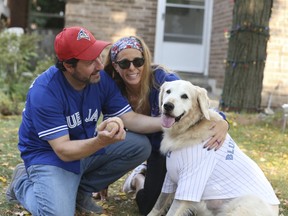 Steven Klein, his wife Sandy and their golden retriever named Benji, who was mauled recently by another dog at an off-leash area in Vaughan.