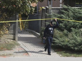 Peel Regional Police officers investigate the murder of Adrian Ebonka in Brampton on Wednesday, Sept. 30, 2020. The 20-year-old was gunned down on a pathway near McLaughlin Rd. S. and Ray Lawson Blvd. around 11 p.m. Tuesday.