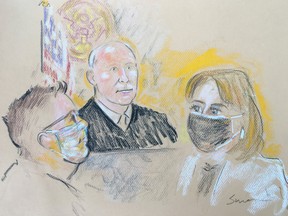 Pascale Cecile Veronique Ferrier, 53, who was arrested on the Canada-U.S. border on suspicion of sending a ricin-filled envelope to the White House and to five other addresses, attends her initial federal court appearance before U.S. Magistrate Judge H. Kenneth Schroeder, Jr. and her defense attorney in a court sketch in Buffalo, New York, U.S. September 22, 2020.