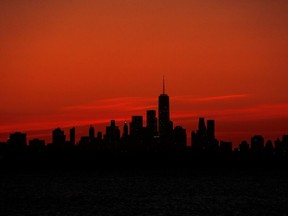 One World Trade Center and the lower Manhattan skyline are seen shortly after sunset, during the outbreak of the coronavirus disease (COVID-19) from the Rockaway section of Queens in New York City, U.S., May 20, 2020.