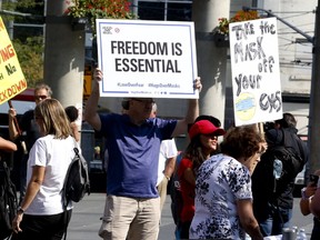 Hundreds of anti-lockdown protesters gathered at Yonge-Dundas Square to protest Covid-19 safety measures on Saturday, Sept. 26, 2020.