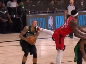 Pascal Siakam, right, of the Raptors, fouls Celtics player Daniel Theis in Game 5 of their NBA playoff series on Monday, Sept. 7, 2020.