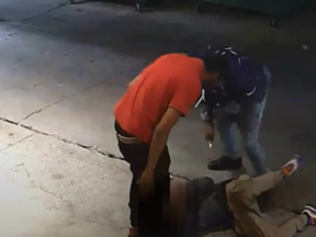Investigators need help identifying two assailants who savagely attacked and stabbed a man on O'Keefe Lane, steps away from Yonge-Dundas Square, on Aug. 28, 2020.