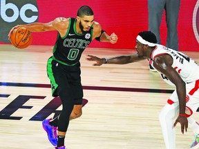 Celtics forward Jayson Tatum (looks for room to drive past Pascal Siakam of the Raptors during Game 2 on Tuesday. Tatum has outscored Siakam 55-30 through the first two games, both Boston wins.